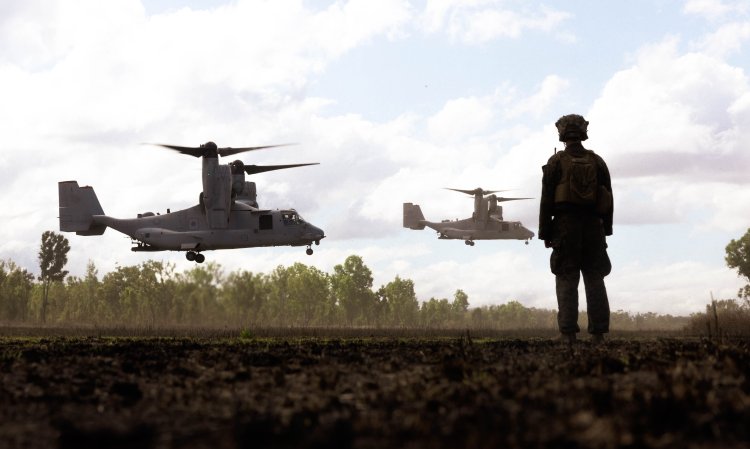 U.S. Marine Corps 1st Lt. Joshua Watson, the executive officer of Lima Co., 3rd Battalion, 1st Marine Regiment (Reinforced), Marine Rotational Force – Darwin 23, watches MV-22B Osprey tiltrotor aircraft land during Exercise Southern Jackaroo 23 in Townsville Field Training Area, Queensland, Australia, July 6, 2023. Southern Jackaroo is a trilateral exercise with MRF-D, Japanese Ground Self-Defense Force, and Australian Defence Force, with Republic of Korea observers, working together to achieve fire, maneuver, and communications interoperability objectives. Watson is a native of Woodbridge, Virginia. (U.S. Marine Corps photo by Cpl. Brayden Daniel)